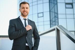 Portrait of an handsome businessman in an urban setting photo