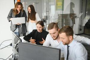 Group of businessmen and businesswomen stock brokers working at office. photo