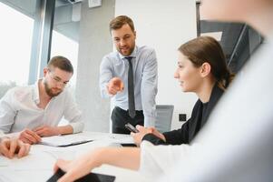 A group of business people partners during a set team meeting in the modern office. Teamwork concept photo