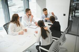 Group of young people in business meeting photo