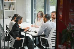 Corporate business team and in a meeting at modern office with big windows . High quality photo