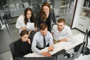 Group of young people in business meeting photo