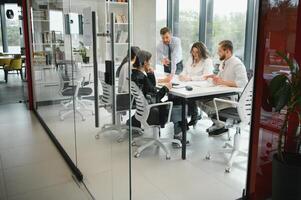 Corporate business team and in a meeting at modern office with big windows . High quality photo