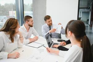 Business people working on project in office photo