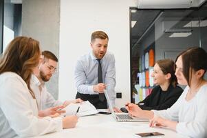 Group of young people in business meeting photo