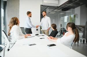 Corporate business team and in a meeting at modern office with big windows . High quality photo