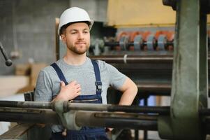 Factory worker. Man working on the production line. photo