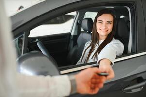 Salesperson selling cars at car dealership photo