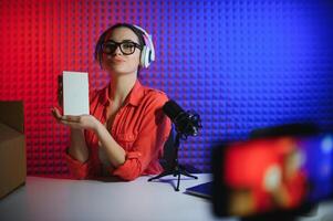 Young creative woman live streaming a for her followers on social media photo