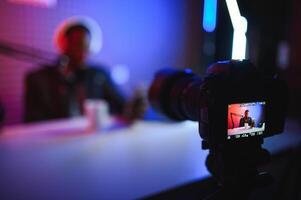 Cheerful young African American male blogger photo