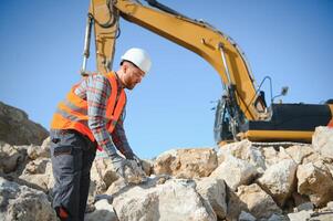 Quarry worker doing a quality check photo