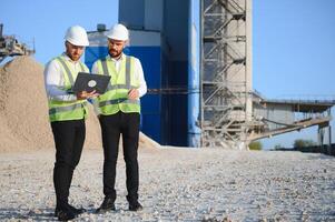 Engineers at a stone crushing plant. photo