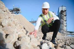 Engineer at the Crushed stone production plant. Gravel photo