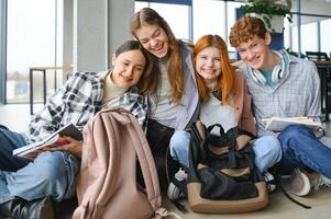 Happy diverse college students posing for group portrait, looking at camera, smiling photo