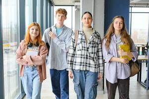 Happy high school students in the classroom photo