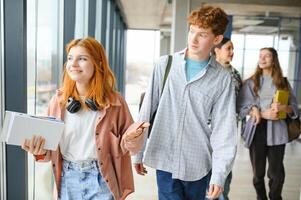 group of college students walking to lecture hall photo