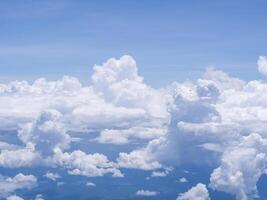 Aerial view of sky and clouds are seen through the airplane Window photo