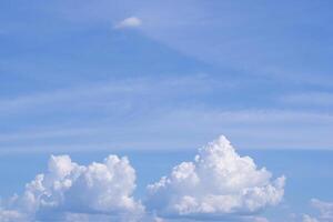 Aerial view of clouds and sky seen through the airplane window photo