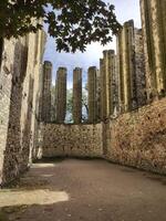 Ruins of an unfinished temple on an energy site in Czech Republic, with sunlight and trees photo