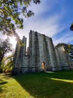 Ruins of an unfinished temple on an energy site in Czech Republic, with sunlight and trees photo