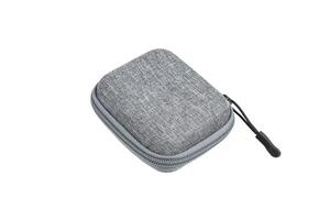 Protective hard case with a zipper and a gray fabric texture. Isolate on a white back photo