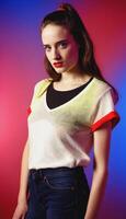 photo of beautiful european woman standing pose with colorful red and blue abstract light ,