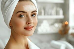 Close up portrait of a young woman patient receiving a laser treatment in a spa salon. photo