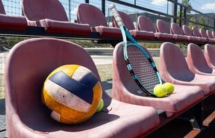 volleyball ball on bench on the sports tribune photo