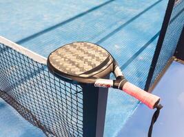 paddle sport on the paddle court, ball, rackets photo