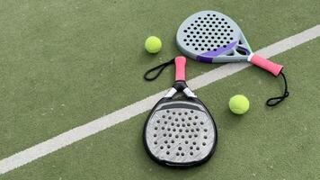 paddle rackets on the playing court photo