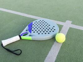 Paddle tennis racket and ball photo