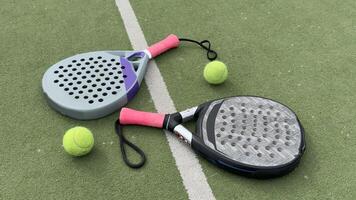padel tennis racket sport court and balls. photo