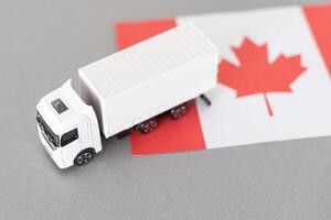 Symbol of National Delivery Truck with Flag of Canada. National Trucking Icon and Canadian flag photo