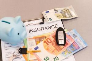 insurance form, folders, piggy bank and money photo