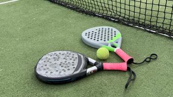 paddle rackets on the playing court photo