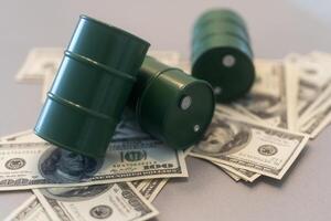 a barrel and dollar bills on a white background. photo