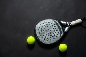 ball racket paddel black background photo