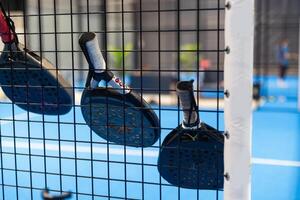 paddle rackets on the playing court photo