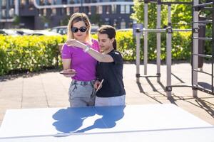 table tennis. mother and daughter play ping pong game. photo