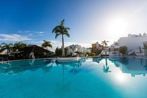 Swimming pool on top of roof deck building. photo