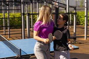 girl plays in table tennis outdoor photo