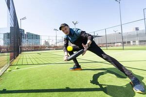 man playing paddle tennis at indoors pitch photo