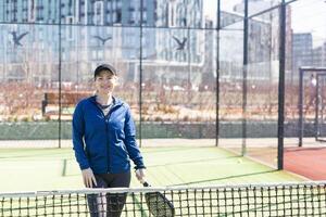 One women playing Paddle tennis photo