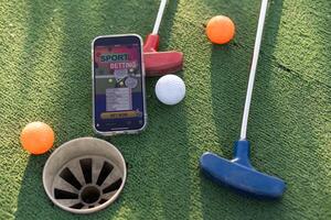 mini golf sports betting on a smartphone photo