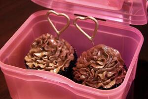 cupcakes with pink decoration and elements for girls' parties photo