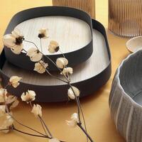 assembly of wooden cups, plates and platters with various fruits and vegetables seen from above photo