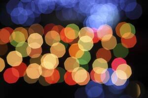 colorful and defocused lights on black background photo