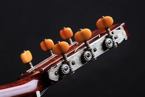 six string guitar close up on black background photo