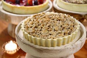 Pecan pie with cream on tray photo