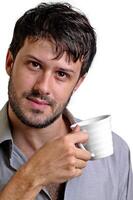 young man with beard in different situations on neutral background photo